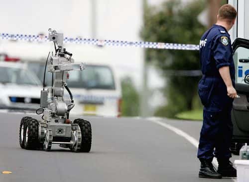 A bomb disposal robot rolls down Wilson Street in Green Valley November 8, 2005 in Sydney, Australia. Sixteen people have been arrested in Sydney and Melbourne overnight, in raids conducted by more than 400 police. A man was also shot in the neck in Green Valley in the same operation. New South Wales Police Commissioner Ken Moroney says a terrorist attack has been foiled.