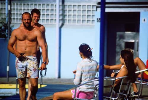 ***EXCLUSIVE ALL-ROUND*** LONDON - July 21, 2003 - Actor Jason Statham and Lock Stock & Two Smoking Barrels co-star Jason Flemyng prepare to take a swim at the Tooting Bec Lido outdoor swimming pool while girlfriend, actress Kelly Brook, looks on with friends. (Photo by Scott Raftery/Getty Images)