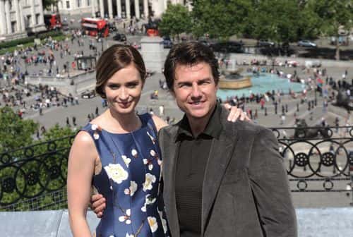 Emily Blunt and Tom Cruise attend a photocall for 'The Edge Of Tomorrow' at The Trafalgar Hotel on May 25, 2014 in London, England.