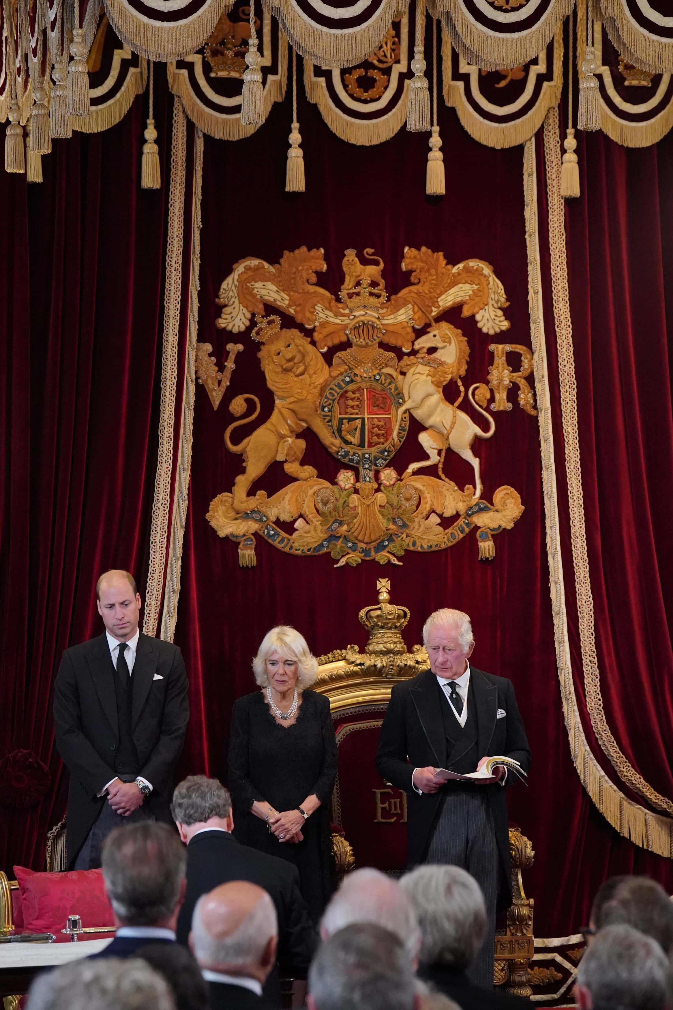 William, Prince of Wales, and Camilla, Queen Consort, look on as King Charles III attends his proclamation as King during the accession council on September 10, 2022 in London, United Kingdom. His Majesty The King is proclaimed at the Accession Council in the State Apartments of St James's Palace, London. The Accession Council, attended by Privy Councillors, is divided into two parts. In part I, the Privy Council, without The King present, proclaims the Sovereign and part II where The King holds the first meeting of His Majesty's Privy Council. The Accession Council is followed by the first public reading of the Principal Proclamation read from the balcony overlooking Friary Court at St James's Palace. The Proclamation is read by the Garter King of Arms, accompanied by the Earl Marshal, other Officers of Arms and the Serjeants-at-Arms.