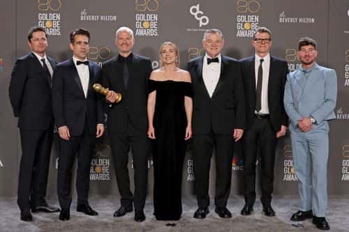 (L-R) Peter Czernin, Colin Farrell, Martin McDonagh, Kerry Condon, Brendan Gleeson, Graham Broadbent, and Barry Keoghan, winners of Best Picture - Musical/Comedy for
