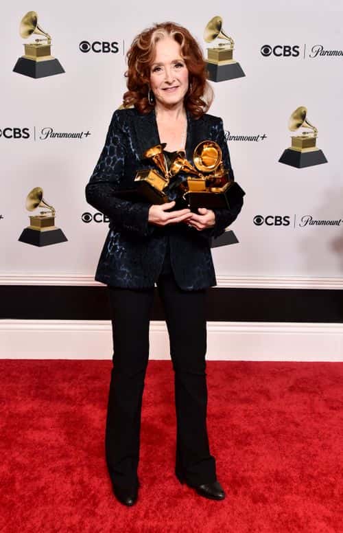 Bonnie Raitt poses with the Best American Performance Award for