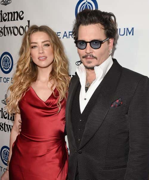 Actors Amber Heard (L) and Johnny Depp attend The Art of Elysium 2016 HEAVEN Gala presented by Vivienne Westwood & Andreas Kronthaler at 3LABS on January 9, 2016 in Culver City, California.