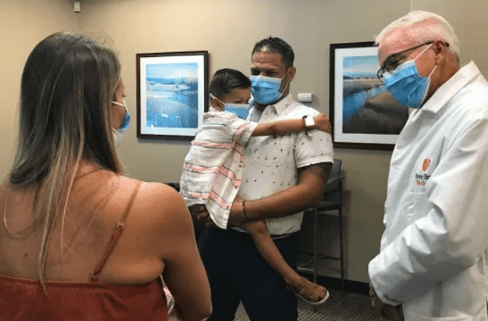 The child lost balance and fell off the porch, forcing the metal straw to go through his tongue and throat (