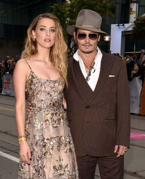 Actors Amber Heard (L) and Johnny Depp attend 