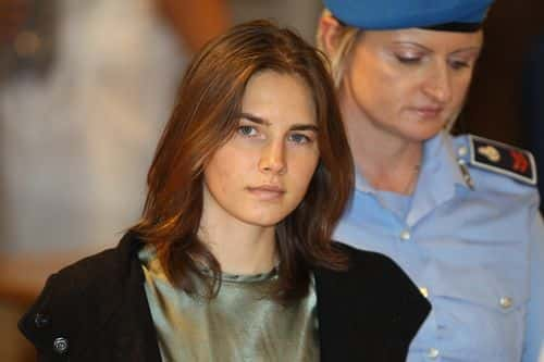 PERUGIA, ITALY - SEPTEMBER 29:  Amanda Knox (L) is escorted to her appeal hearing at Perugia's Court