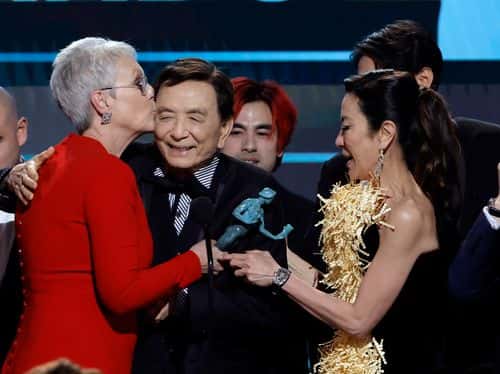 (L-R) Jamie Lee Curtis, James Hong, Andy Le, and Michelle Yeoh accept the Outstanding Performance by a Cast in a Motion Picture award for