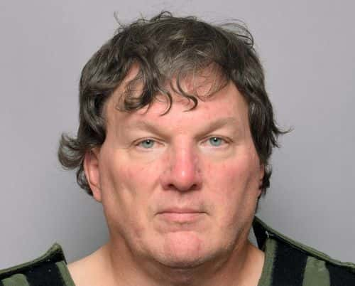 In this handout provided by the Suffolk County Sheriff’s Office, Rex Heuermann poses for his booking photo on July 14, 2023. Heuermann, 59, is charged with three counts of first-degree murder for the killings of Melissa Barthelemy in 2009, and Megan Waterman and Amber Costello the following year, according to the Suffolk County District Attorney. He pleaded not guilty to the murders and a judge ordered he be held without bail.