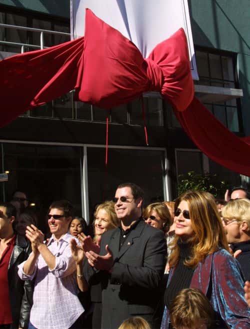 ***EXCLUSIVE*** (TABS OUT, U.S. & CANADA SALES ONLY): (L to R) Actors Tom Cruise, Kelly Preston, John Travolta and Kirstie Alley listen to actress Jenna Elfman speak at the opening of the Church of Scientology, Mission of SoMa September 29, 2001 in San Francisco, CA. The new church was established by Jenna Elfman.
