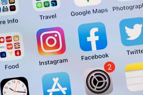 In this photo illustration, the Facebook and Instagram apps are seen on the screen of an iPhone on October 04, 2021 in San Anselmo, California. Social media applications Facebook, Instagram and WhatsApp are experiencing a global outage that started before 9 a.m. (P.S.T.) on Monday morning.