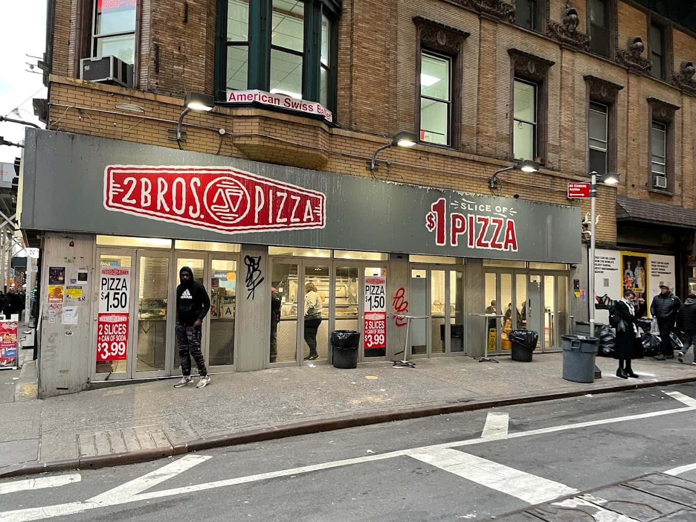 Albanni allegedly slashed a 65-year-woman with a kitchen knife on the sidewalk outside 2 Bros Pizza on Eighth Avenue and West 38th Street (Google Maps)