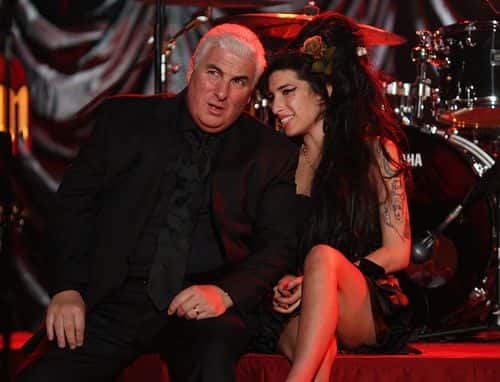 British singer Amy Winehouse sits with her father Mitch as they await news of her Grammy Award at The Riverside Studios for the 50th Grammy Awards ceremony on February 10, 2008 in London, England. Winehouse won 5 out of her 6 nominations including, record of the year, best new artist, song of the year, pop vocal album and female pop vocal performance.