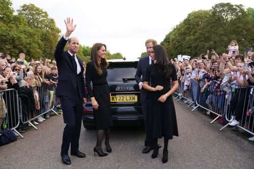 Catherine, Princess of Wales, Prince William, Prince of Wales, Prince Harry, Duke of Sussex, and Meghan, Duchess of Sussex meet members of the public on the long Walk at Windsor Castle on September 10, 2022 in Windsor, England. Crowds have gathered and tributes left at the gates of Windsor Castle to Queen Elizabeth II, who died at Balmoral Castle on 8 September, 2022.