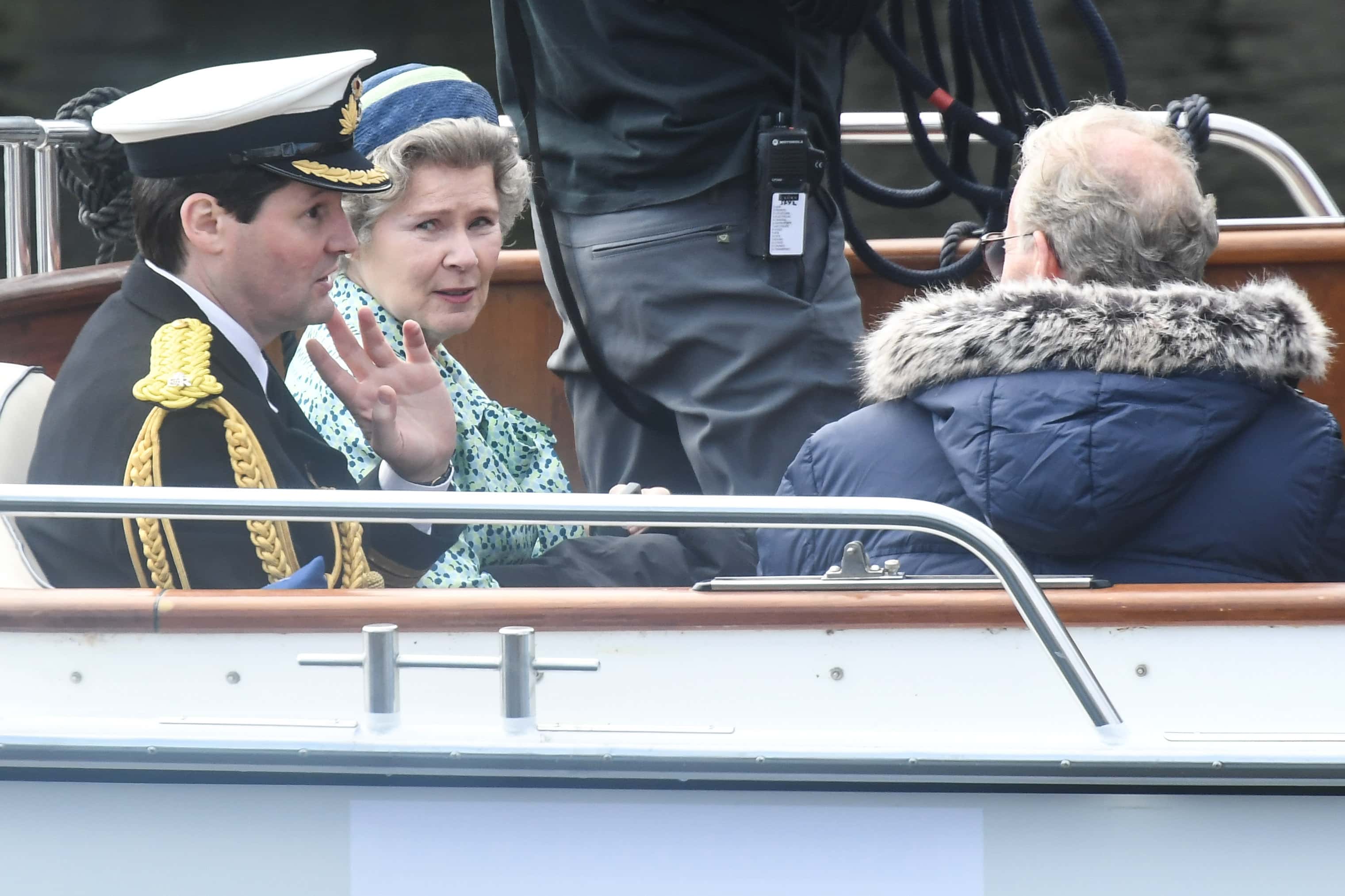 Imelda Staunton and other cast members are seen on a boat made to look like a Royal yacht tender in the harbour during filming for the Netflix series