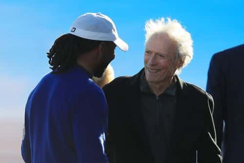 Actor Clint Eastwood talks with Larry Fitzgerald of the Arizona Cardinals after the final round of the AT&T Pebble Beach Pro-Am at Pebble Beach Golf Links on February 09, 2020 in Pebble Beach, California.