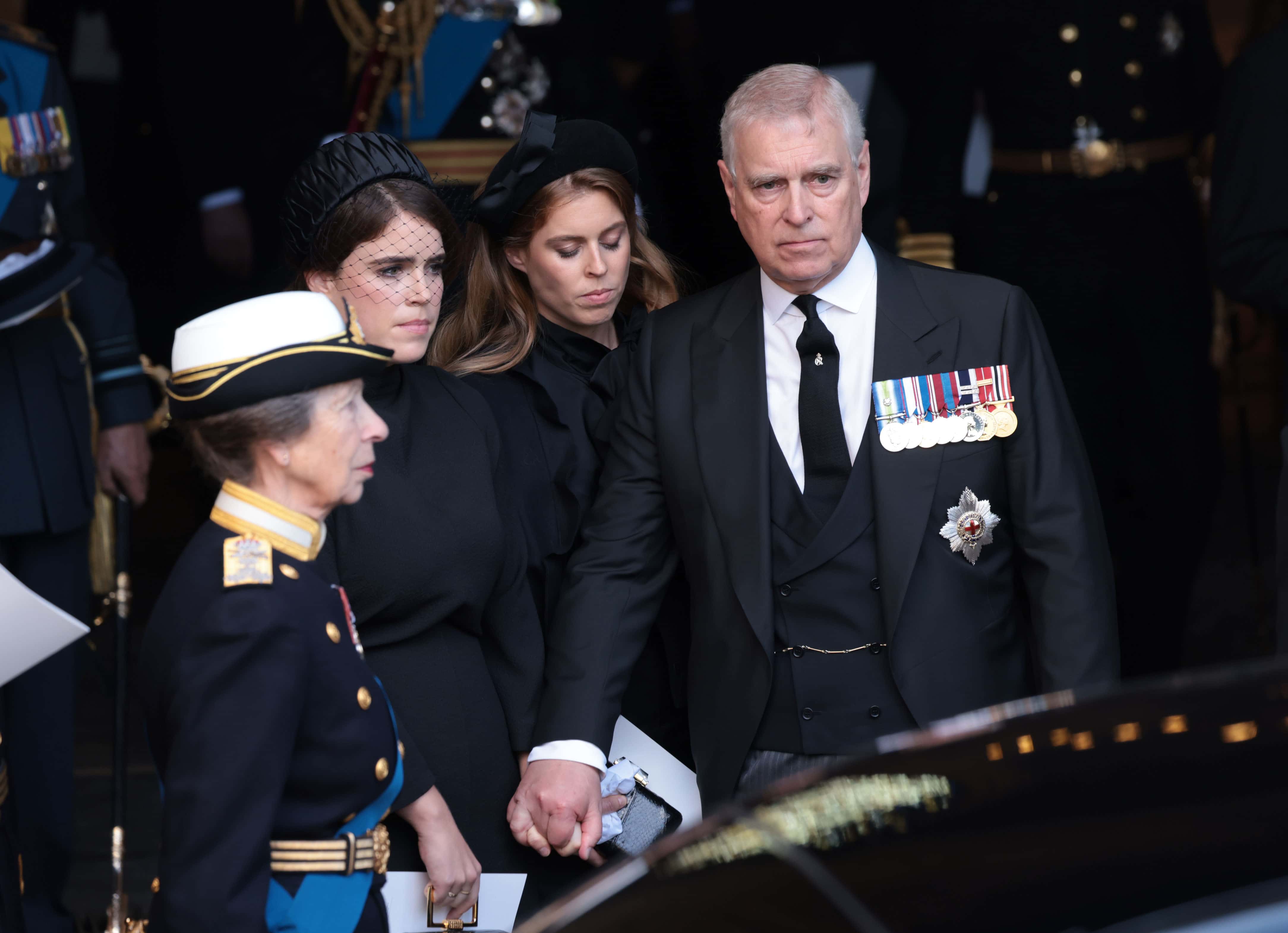 (L) Princess Anne, Princess Royal, Princess Eugenie, Princess Beatrice and Prince Andrew, Duke of York at Westminster Hall on September 14, 2022, in London, England. Queen Elizabeth II's coffin is taken in procession on a Gun Carriage of The King's Troop Royal Horse Artillery from Buckingham Palace to Westminster Hall where she will lay in state until the early morning of her funeral. Queen Elizabeth II died at Balmoral Castle in Scotland on September 8, 2022, and is succeeded by her eldest son, King Charles III III.