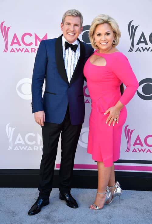 TV personalities Todd Chrisley (L) and Julie Chrisley attend the 52nd Academy Of Country Music Awards at Toshiba Plaza on April 2, 2017 in Las Vegas, Nevada.