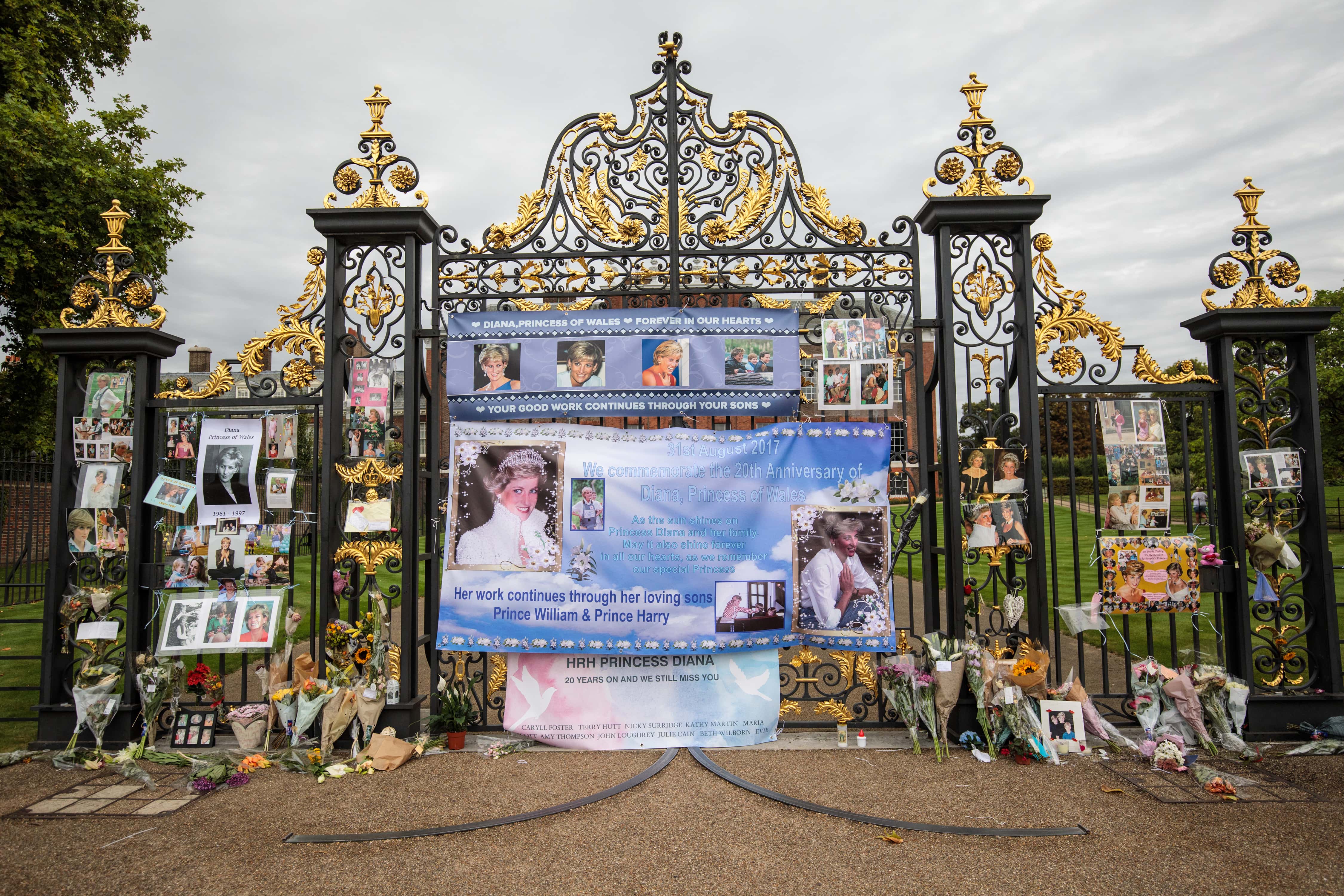 Floral tributes, photographs and messages sit outside an entrance gate to Kensington Palace ahead of the 20th anniversary of the death of Diana, Princess of Wales on August 30, 2017 in London, England. On August 31, 1997 Princess Diana was fatally injured, aged 36, in a high speed car crash in a Paris, France. The months following her death saw a huge public outpouring of grief with a sea of tributes left by members of the public outside Kensington Palace.
