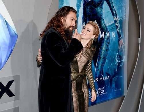 Jason Momoa (L) and Amber Heard attend the premiere of Warner Bros. Pictures'