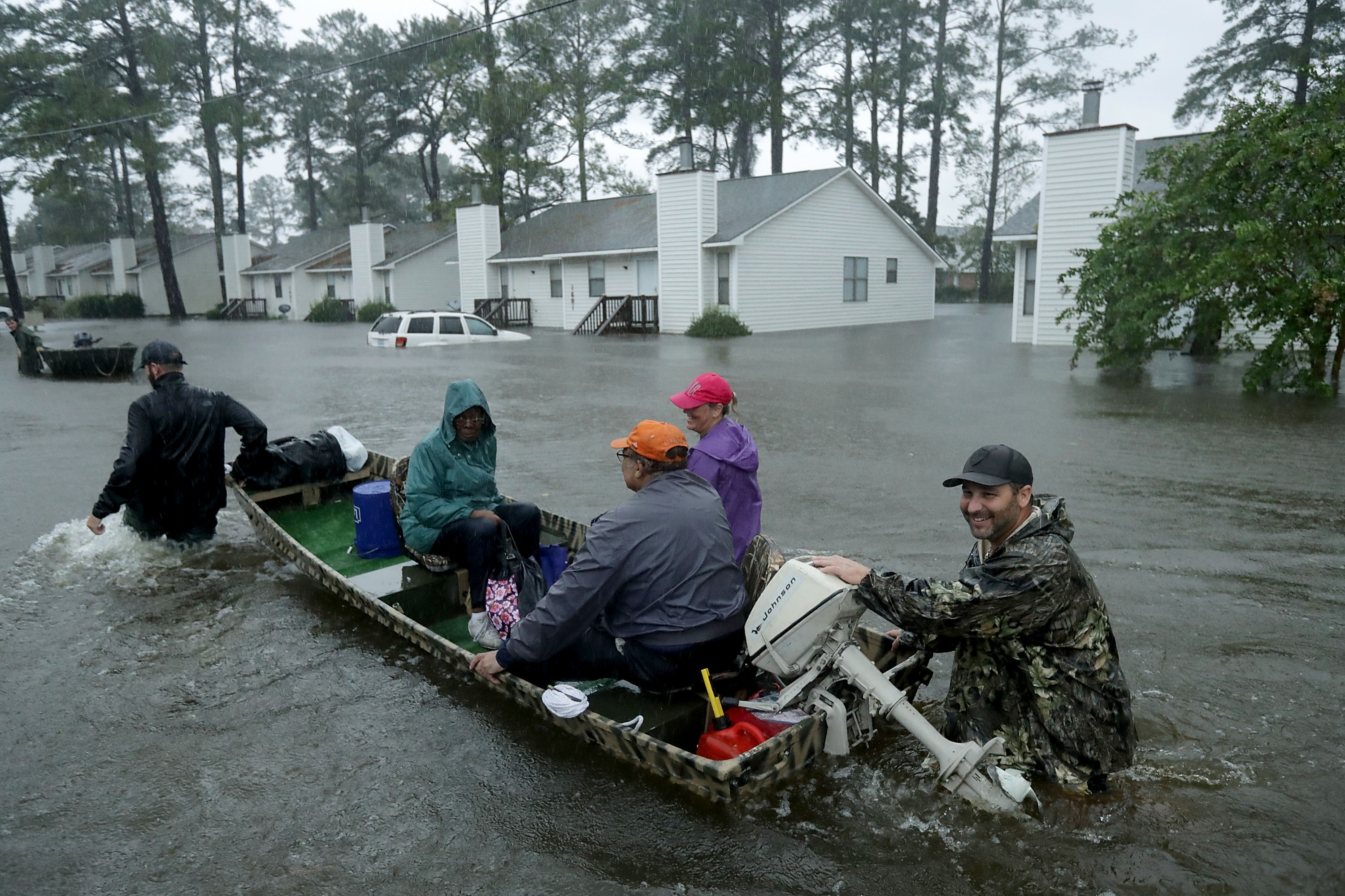 Volunteers from all over North Carolina help rescue residents and their pets from their flooded homes during Hurricane Florence September 14, 2018 in New Bern, North Carolina. Hurricane Florence made landfall in North Carolina as a Category 1 storm and flooding from the heavy rain is forcing hundreds of people to call for emergency rescues in the area around New Bern, North Carolina, which sits at the confluence of the Nuese and Trent rivers.