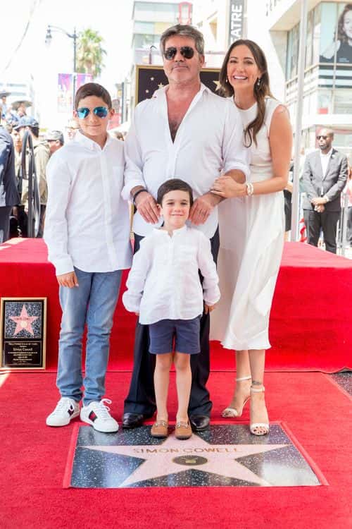 Simon Cowell, Lauren Silverman, Eric Cowell and Adam Silverman attend a ceremony honoring Cowell with a star on the Hollywood Walk of Fame on August 22, 2018 in Hollywood, California.