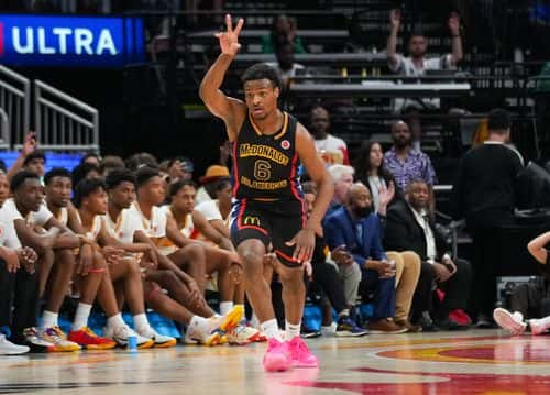 Bronny James #6 of the West team reacts after sinking a three point shot during the 2023 McDonald's High School Boys All-American Game at Toyota Center on March 28, 2023 in Houston, Texas.