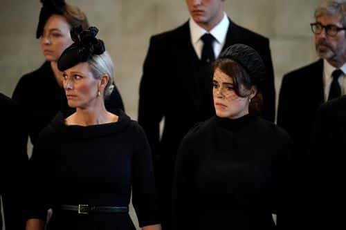 Zara Tindall and Princess Eugenie pay their respects in The Palace of Westminster after the procession for the Lying-in State of Queen Elizabeth II on September 14, 2022 in London, England. Queen Elizabeth II's coffin is taken in procession on a Gun Carriage of The King's Troop Royal Horse Artillery from Buckingham Palace to Westminster Hall where she will lay in state until the early morning of her funeral. Queen Elizabeth II died at Balmoral Castle in Scotland on September 8, 2022, and is succeeded by her eldest son, King Charles III.