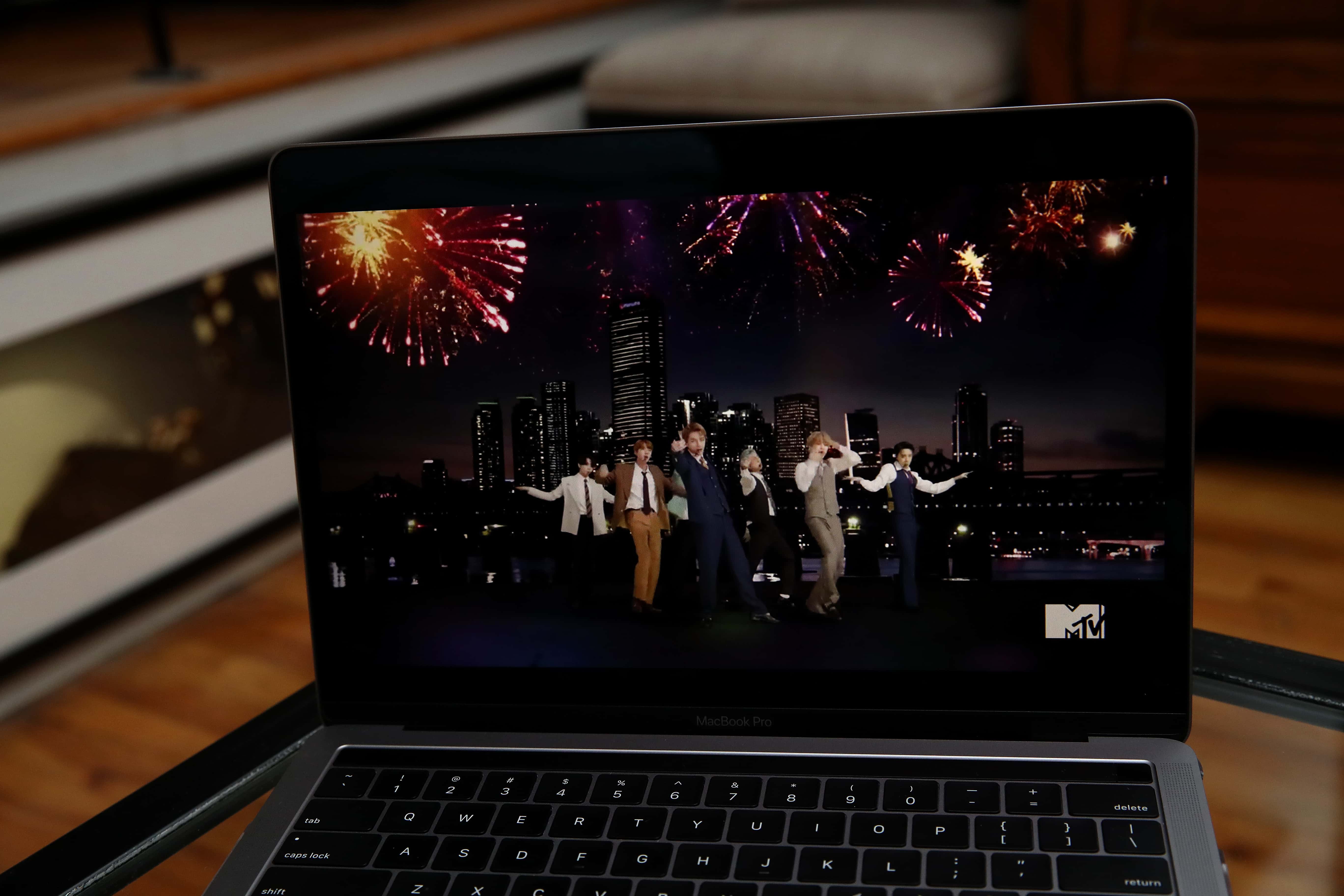 In this photo illustration, BTS, viewed on a laptop, performs during the 2020 MTV Video Music Awards broadcast on August 30, 2020 in  New York City.