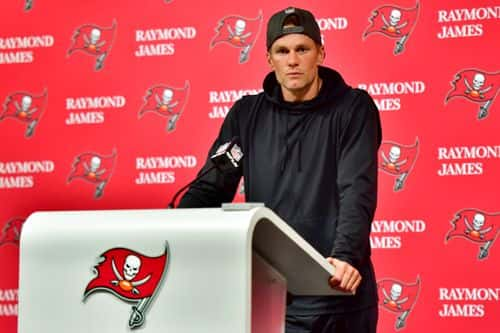 Tom Brady #12 of the Tampa Bay Buccaneers speaks to the media after losing to the Dallas Cowboys 31-14 in the NFC Wild Card playoff game at Raymond James Stadium on January 16, 2023 in Tampa, Florida.