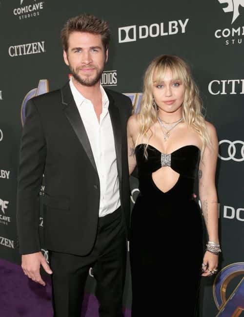 (L-R) Liam Hemsworth and Miley Cyrus attend the Los Angeles World Premiere of Marvel Studios'