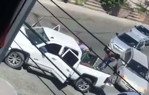 Four of them being kidnapped by the gunmen ( Daily Mail video screenshot)