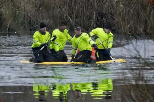 Emergency workers continue the search for further victims after a number of children fell through ice on a lake, on December 12, 2022 at Babbs Mill Park in Solihull, England. Three boys aged eight, 10 and 11 have died after falling through an icy lake last night. The search continued for more potential victims, following reports more children were present on the ice at the time of the incident.