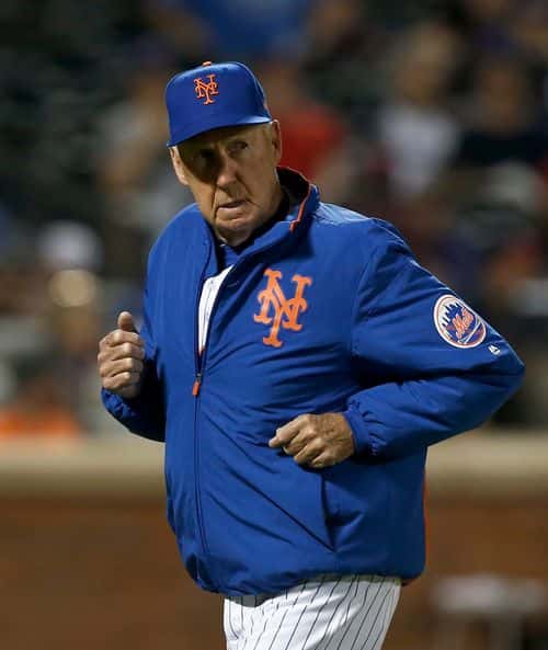 Pitching coach Phil Regan #58 of the New York Mets runs to the dugout during the sixth inning against the Atlanta Braves at Citi Field on June 30, 2019 in New York City.