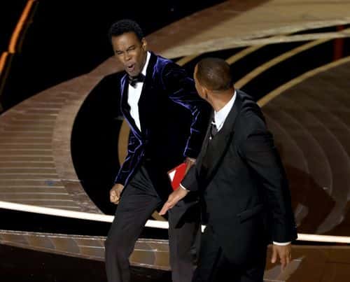 Will Smith appears to slap Chris Rock onstage during the 94th Annual Academy Awards at Dolby Theatre on March 27, 2022 in Hollywood, California.