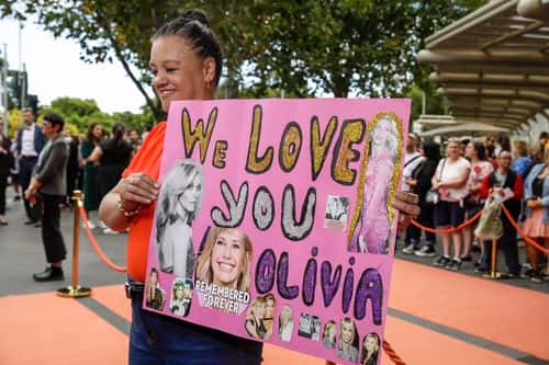 Fan Justine Edwards at State Memorial Service for Olivia Newton-John at Hamer Hall on February 26, 2023 in Melbourne, Australia.