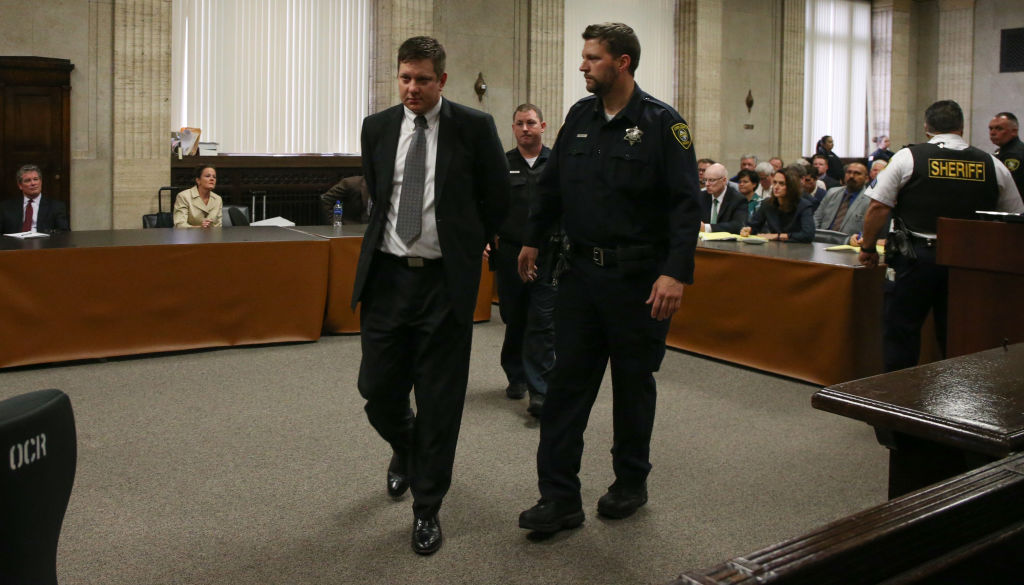 Chicago police Officer Jason Van Dyke, left, is lead away in handcuffs after his guilty verdict in his trial for the shooting death of Laquan McDonald, at the Leighton Criminal Court Building on October 5, 2018 in Chicago, Illinois. (Photo by Antonio Perez - Pool/Getty Images)