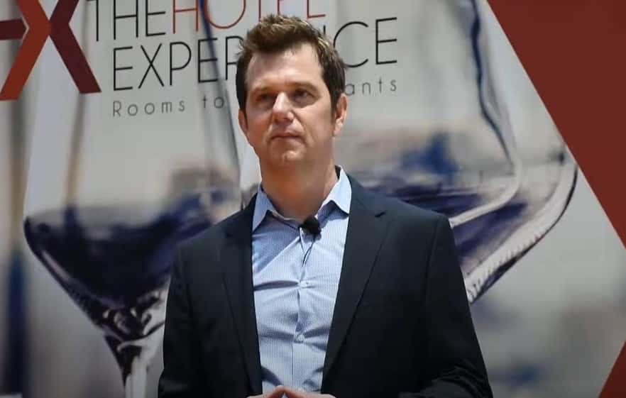 Hague was seen repeatedly kicking the dog as it cowered in the elevator before yanking it with a leash and swinging him around. (WC&A/YouTube)